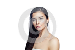 Beautiful brunette girl isolated on white. Spa woman with perfect skin and long healthy dark hair