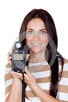 Beautiful brunette girl with a photometer photo