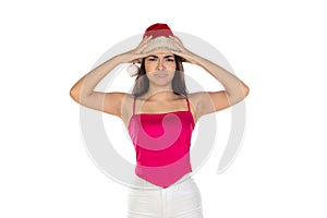 Beautiful brunette girl in santa claus hat isolated on white background with copy space