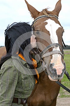 Beautiful brunette with horse photo