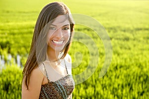 Beautiful brunette indian woman in green fields
