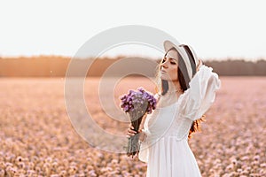 Beautiful brunette in a lavender field at sunset Amazing Portrait