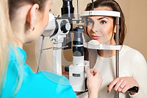 Beautiful brunette passes check vision an ophthalmologist