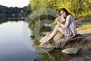 Beautiful brunette senior woman studying for her exams sitting o