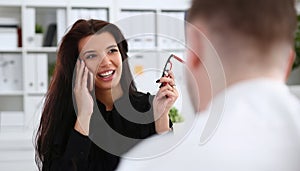 Beautiful brunette smiling businesswoman talk cellphone