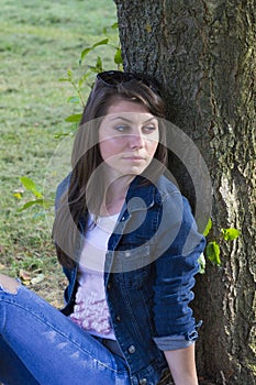 Beautiful brunette in summer park