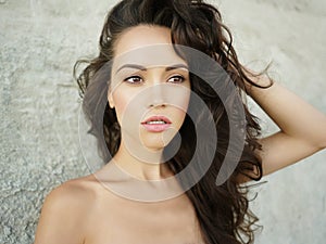 Beautiful brunette woman on the beach