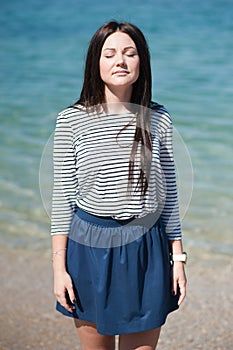 Beautiful brunette woman on the beach