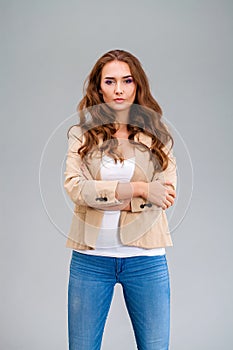 Beautiful brunette woman in a beige jacket