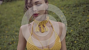 Beautiful brunette woman in crochet bikini