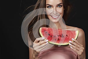 Beautiful brunette woman eating watermelon on a white background, healthy food, tasty food, organic diet, smile healthy, blac