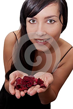 Beautiful brunette woman holding red rose