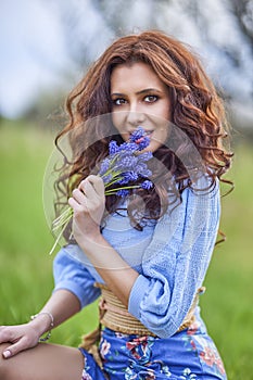 Beautiful brunette woman in spring nature