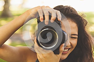 Beautiful brunette woman taking a picture