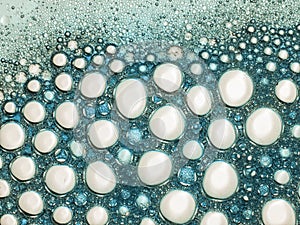Beautiful bubbles, froth. Turquoise and white soapy lather.