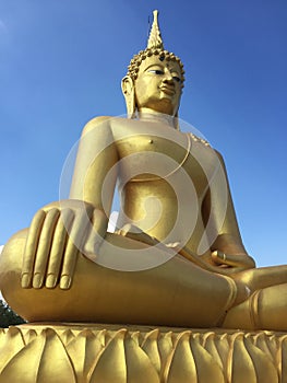 A beautiful Buddha statute with blue sky cloud
