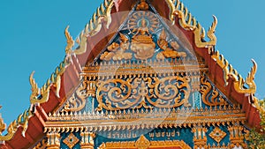 Beautiful Buddhist gilded temple with variety of ornaments and religious symbols