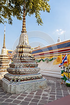 Beautiful Buddhist temple Wat Pho in the capital of Thailand Bangkok against the blue sky, bright colors, sights, a trip to Asia,