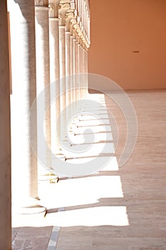 a beautiful building with columns in a park