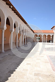 a beautiful building with columns in a park