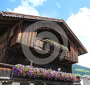 Beautiful building with flowers in San Candido