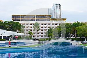 The beautiful building of hotel with the pool at ashore sea. The most beautiful beach with the pool for rest and a holiday