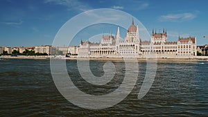 Beautiful building of the Hungarian Parliament in Budapest, in the foreground river Danube