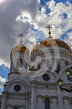 Beautiful building of the Russian Orthodox Church. Covered in gold dome. Crosses and exterior decoration. Love to God