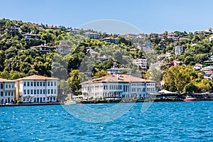 Beautiful builings and mansions at the costline and hillslope with green forest in summer, at Bosphorus Strait in Istanbul,Turkey
