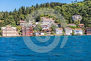 Beautiful builings and mansions at the costline and hillslope with green forest in summer, at Bosphorus Strait in Istanbul,Turkey