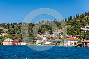 Beautiful builings and mansions at the costline and hillslope with green forest in summer, at Bosphorus Strait in Istanbul,Turkey