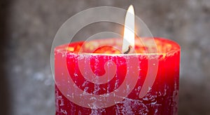 beautiful burning red candle in high resolution