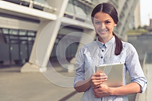 Beautiful business lady with gadget