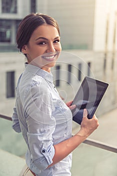 Beautiful business lady with gadget