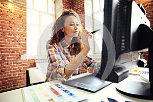 Beautiful business lady smiling while working in office.