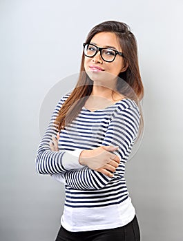 Beautiful business positive woman in glasses looking with thinking look on empty space background.