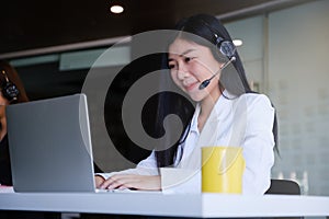 Beautiful business woman or call center workers in headphones for communication and consulting people. Support concept