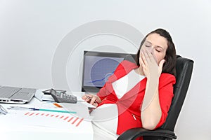 Beautiful business woman dreaming while working on computer at h