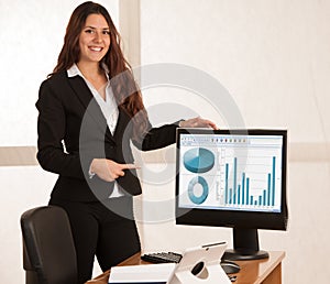 Beautiful business woman in her office with blank space on her m