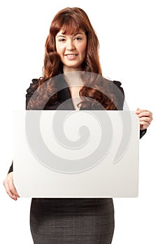 Beautiful business woman holding a blank billboard