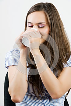 Beautiful business woman holding coffee cup