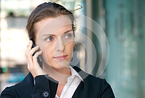 Beautiful business woman listening to phone call on mobile