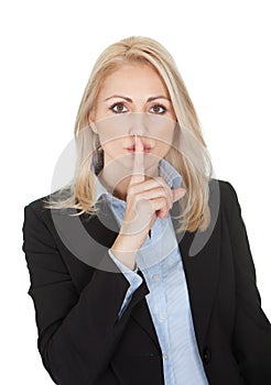 Beautiful business woman making a silence gesture