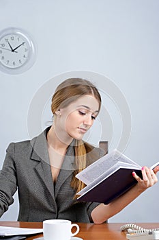 Beautiful business woman reading