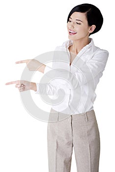 Beautiful business woman showing copy space