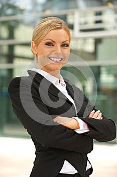 Beautiful business woman smiling outdoors