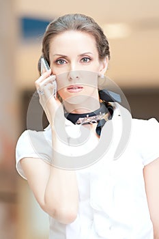 Beautiful business woman talking on cell phone