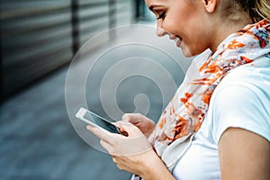 Beautiful business woman using mobile phone outdoors. People communication technology concept.