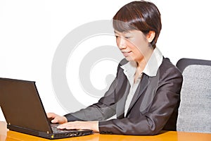 Beautiful business woman working on computer