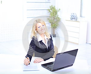 Beautiful business woman working on her laptop